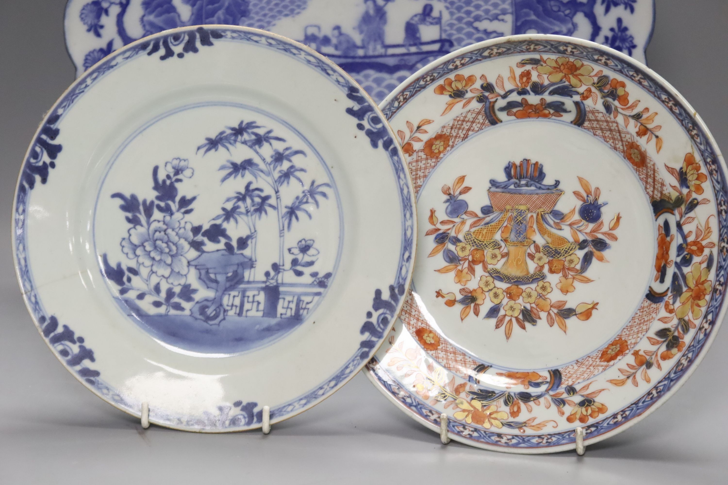 Two Chinese Imari dishes, three Chinese blue and white dishes, a larger Japanese blue and white dish, 5 Japanese blue and white saucer dishes and 2 miniature blue and white jardinieres. 40cm